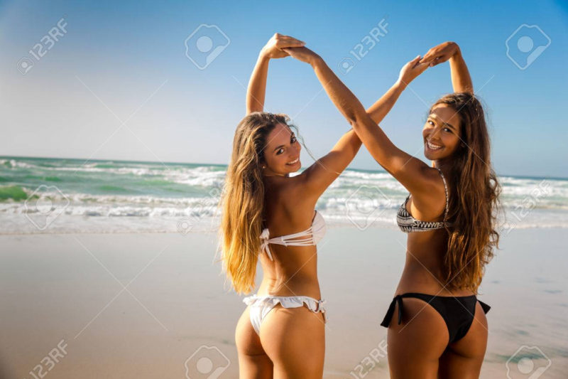 10 Latest Beach Girl Pictures FULL HD 1080p For PC Background 2023 free download beautiful girls in the beach giving her hands together stock photo 800x533